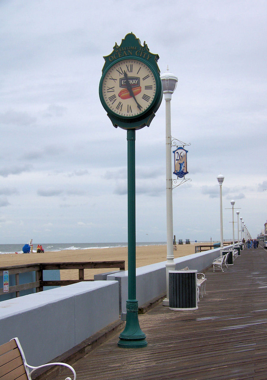 objects time clock on the boardwalk free photo