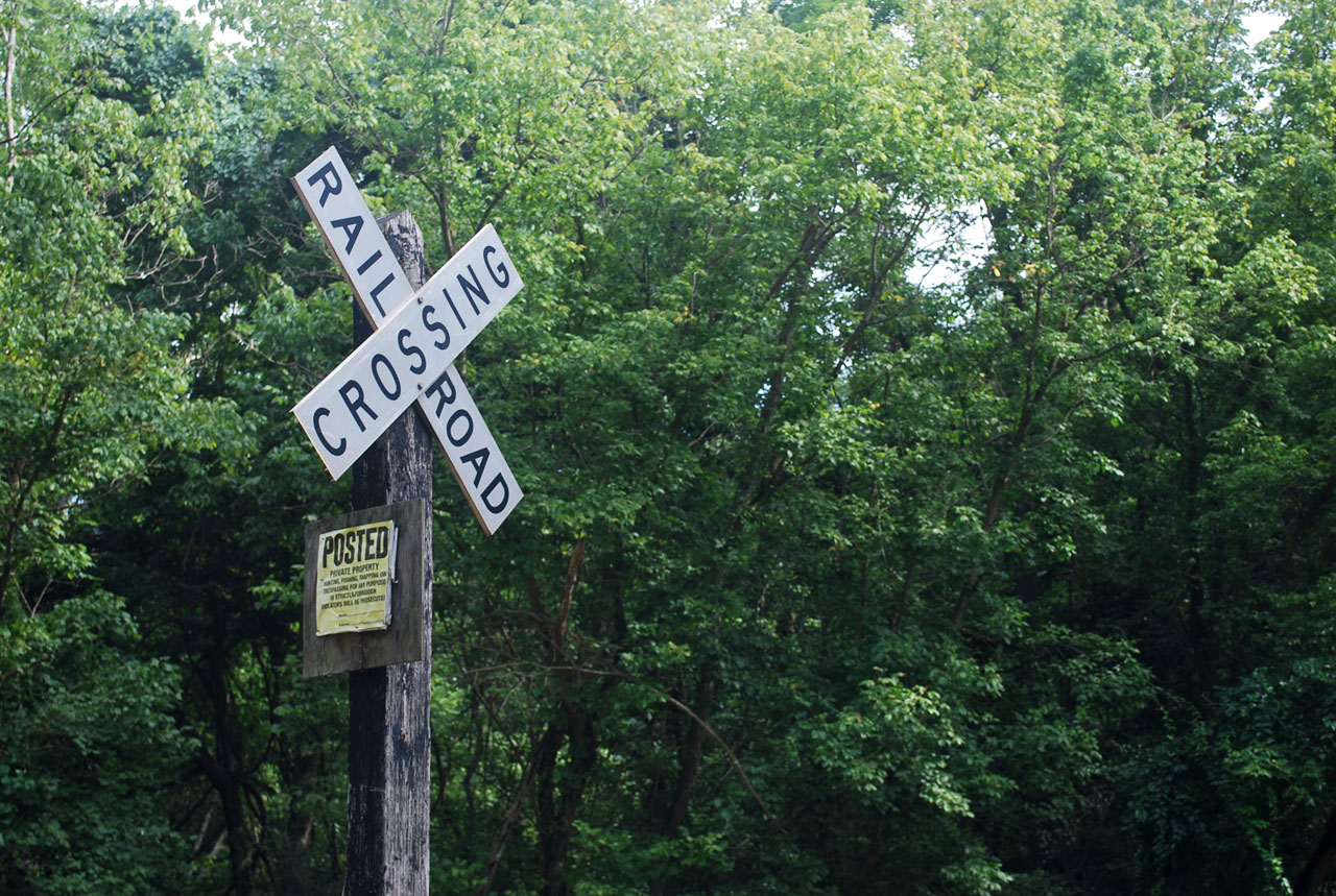 sign crossing railroad free photo
