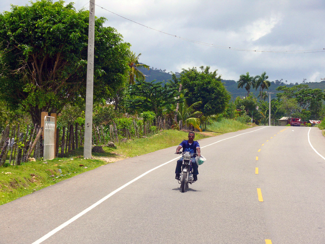 man on motorbike dominican republic road free photo