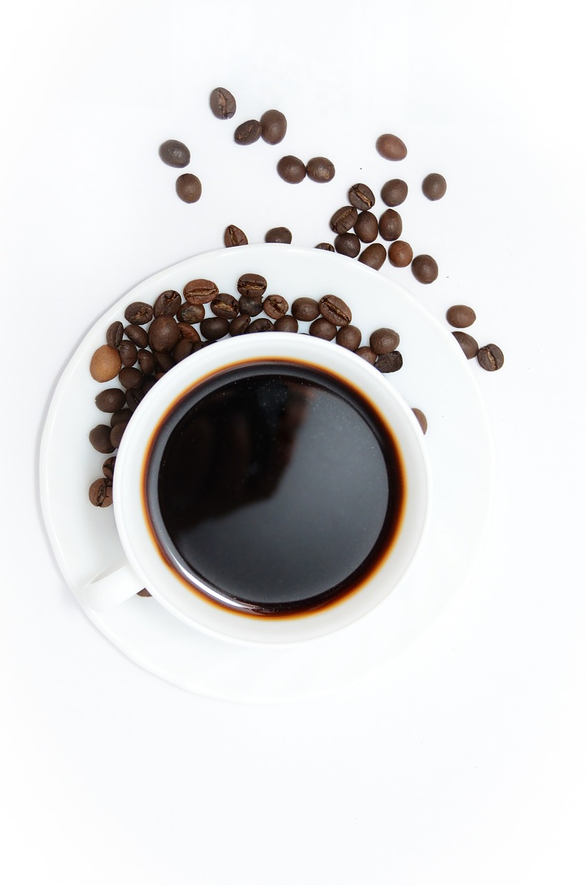 a cup of coffee coffee beans coffee free photo