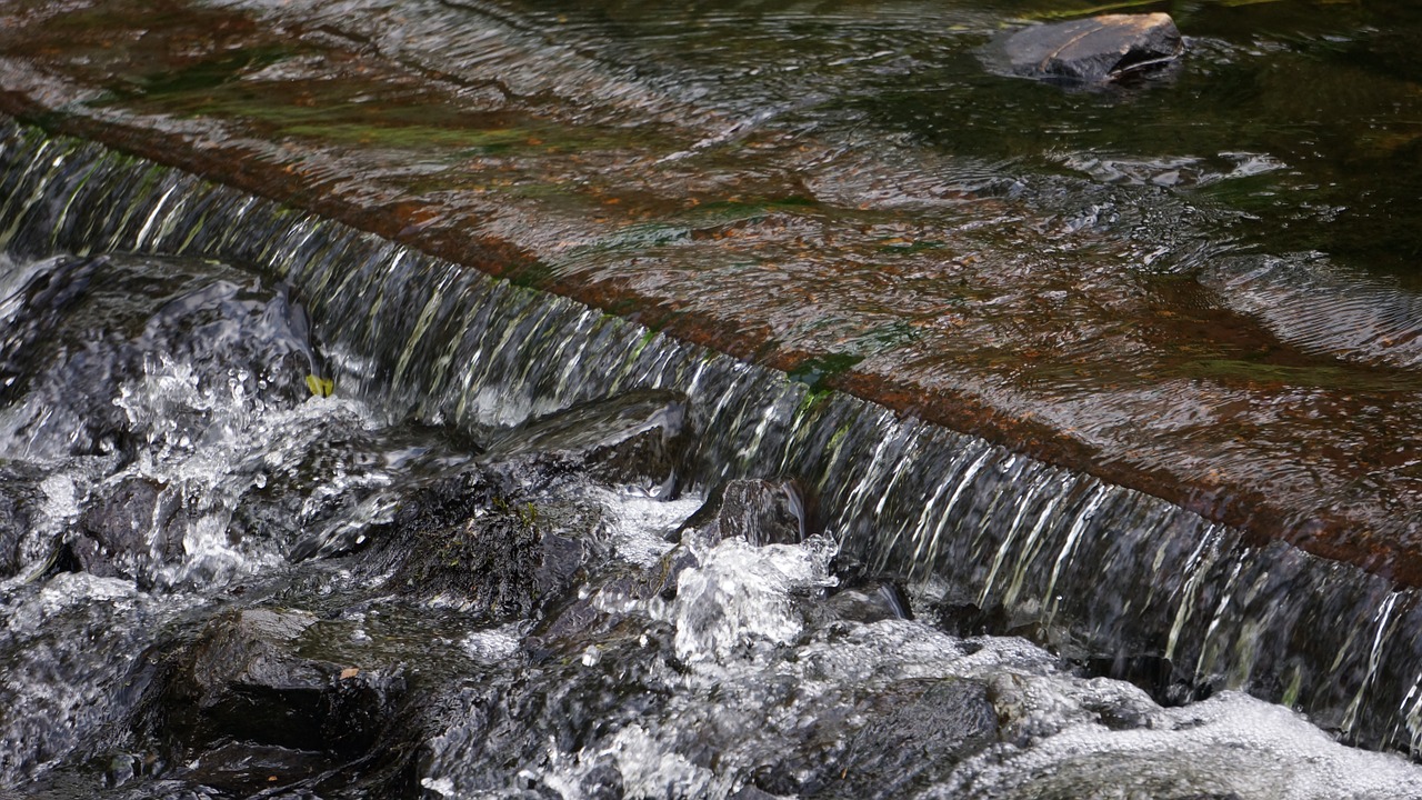 a small waterfall water runoff spatter free photo