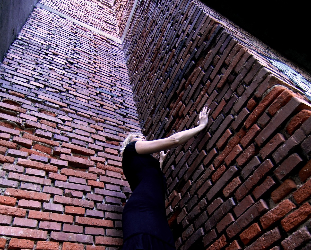 a woman in need trap bricks free photo