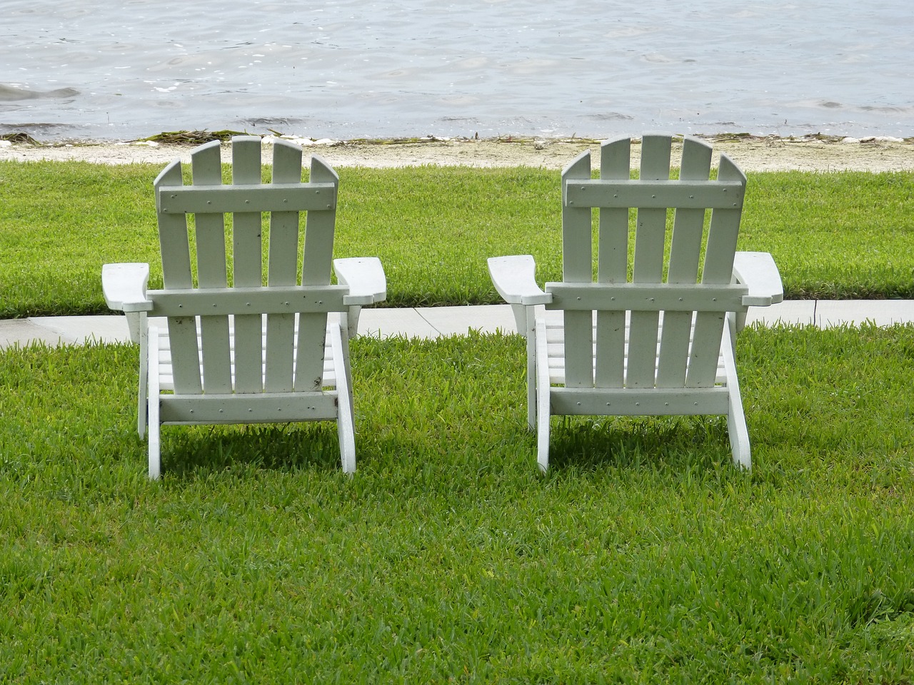 adirondack chairs lake relaxing free photo