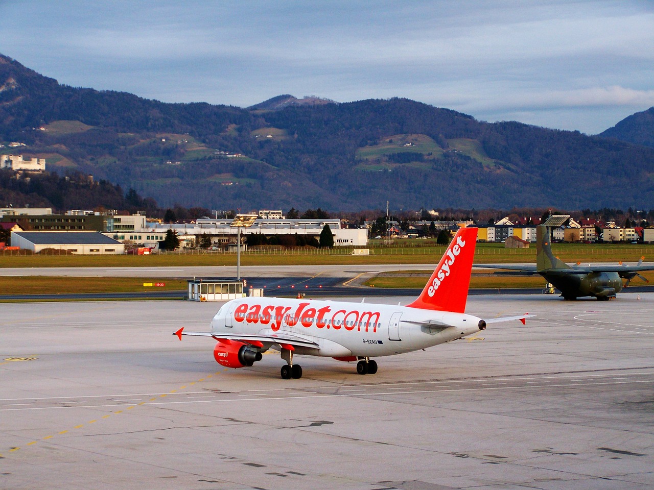 aircraft airport salzburg white-red airplane free photo