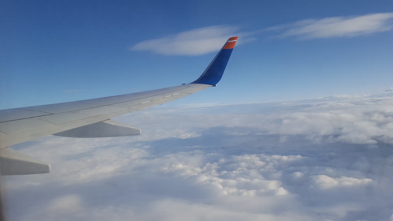 aircraft clouds sky free photo