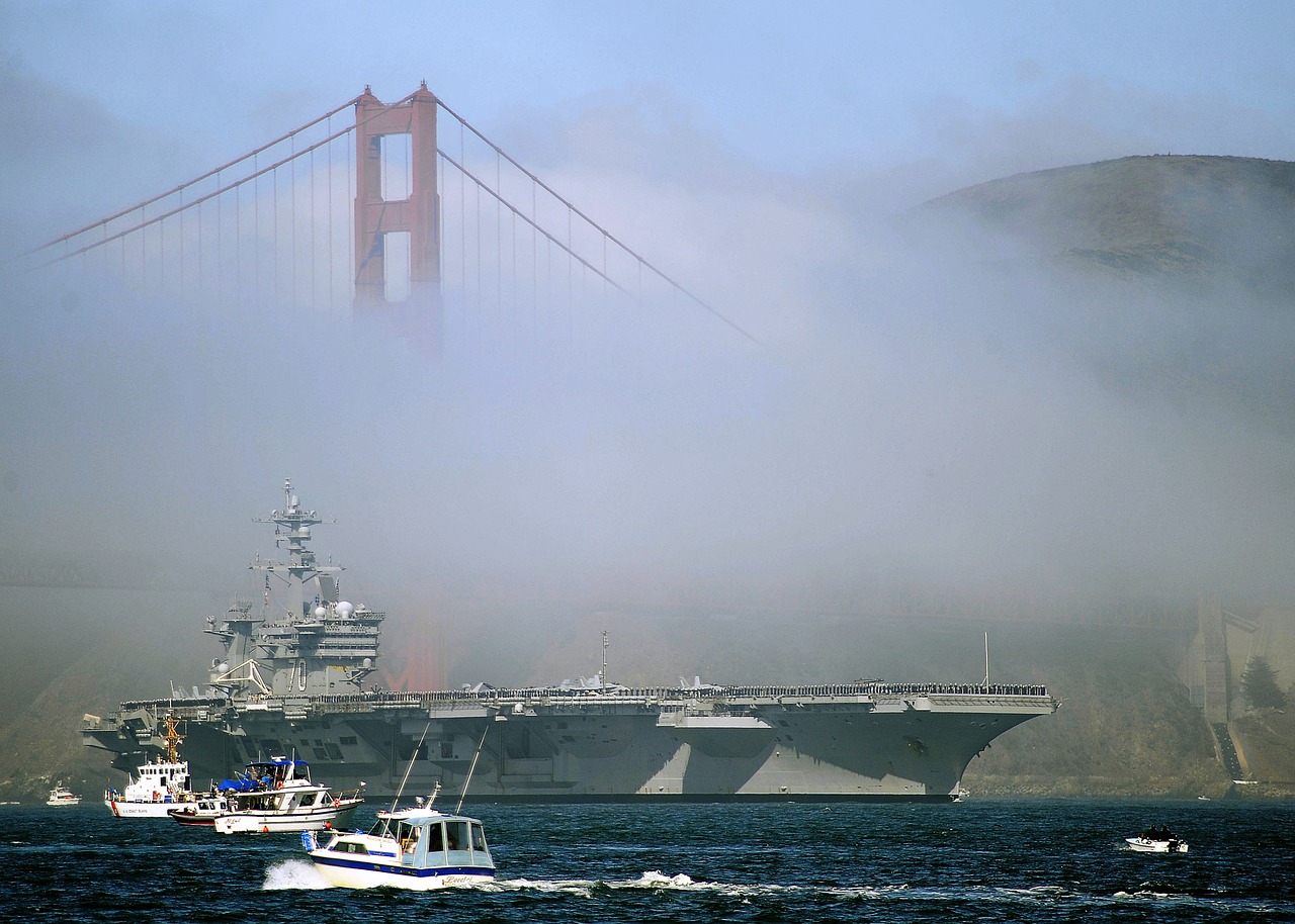 aircraft carrier fog small boats free photo
