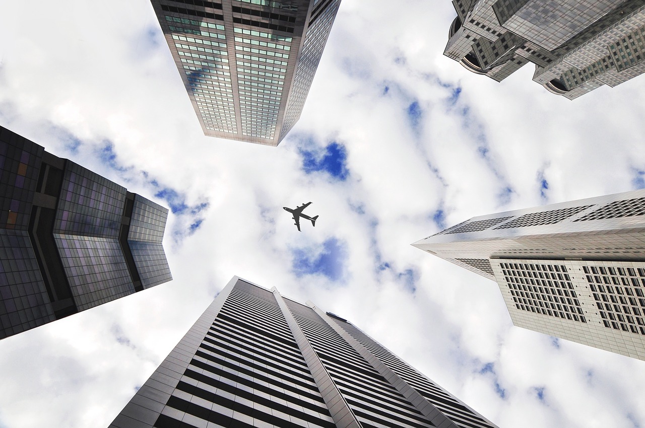 airplane sky buildings free photo