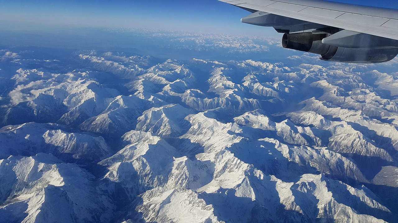 airplane view mountains above free photo