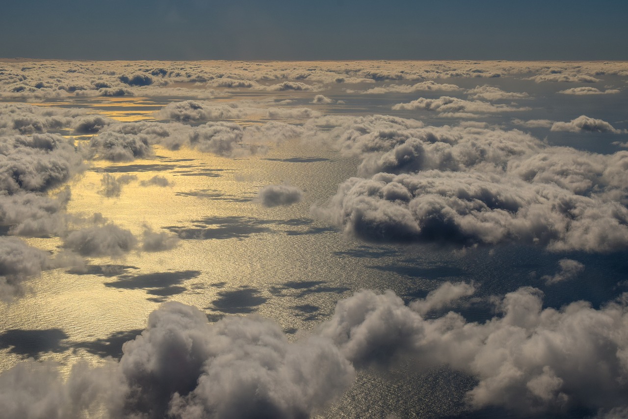 airplane view  clouds  sea free photo