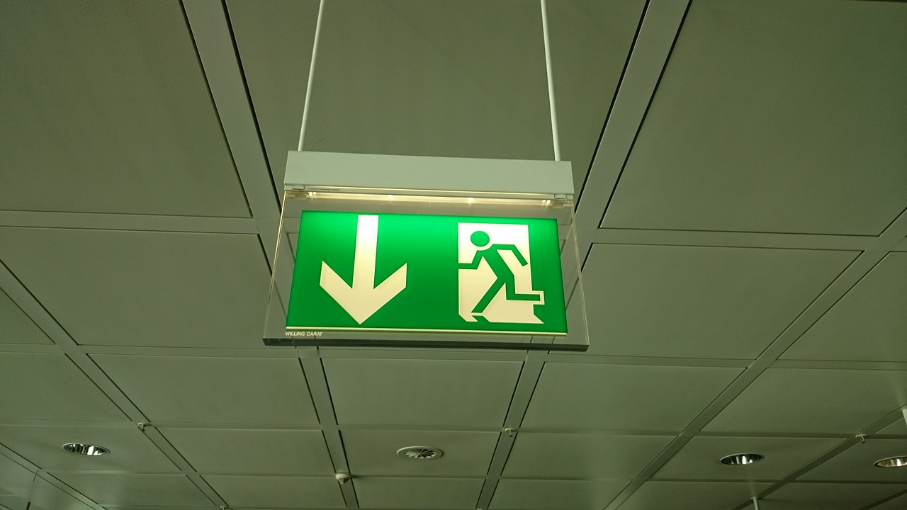 airport emergency exit shield free photo