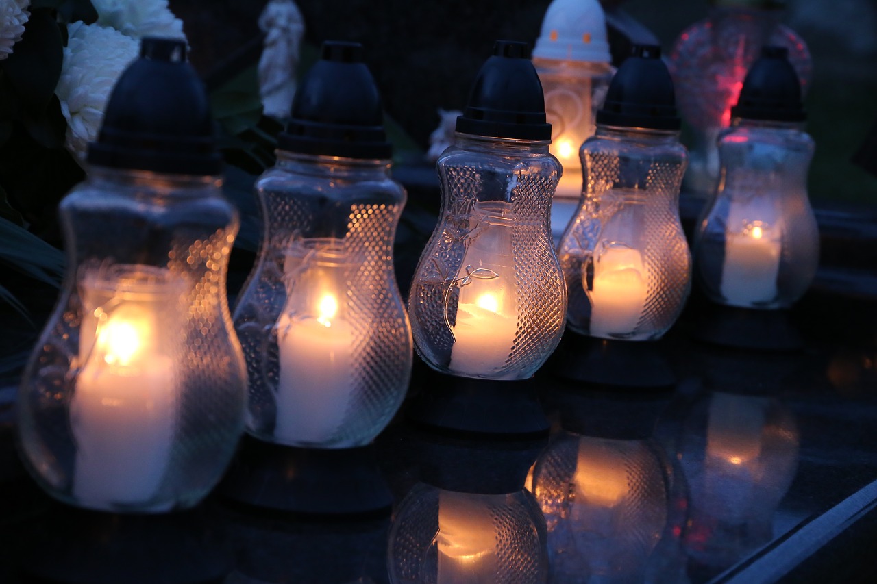all saints  white candles  lanterns free photo