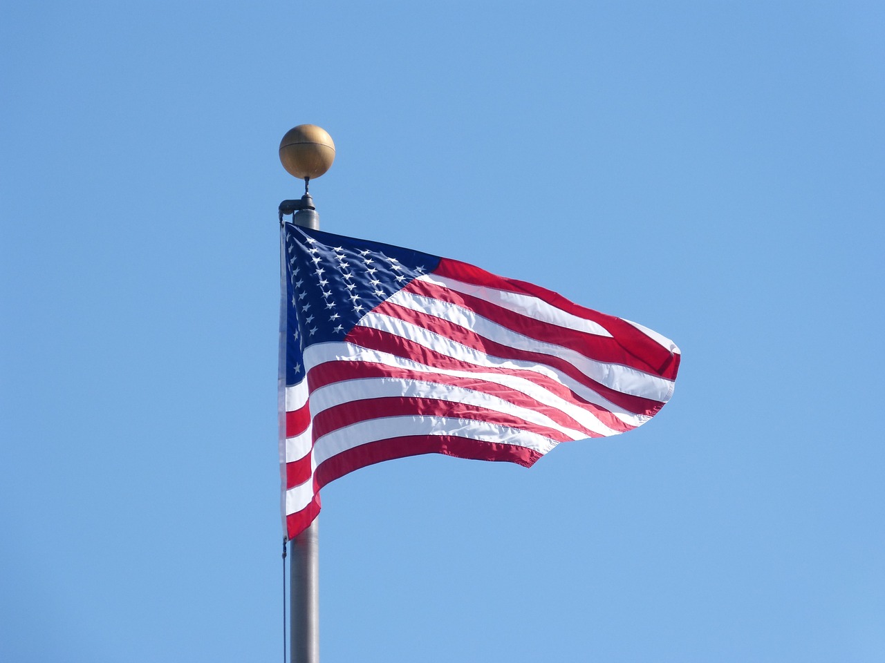 american flag waving flag patriotism