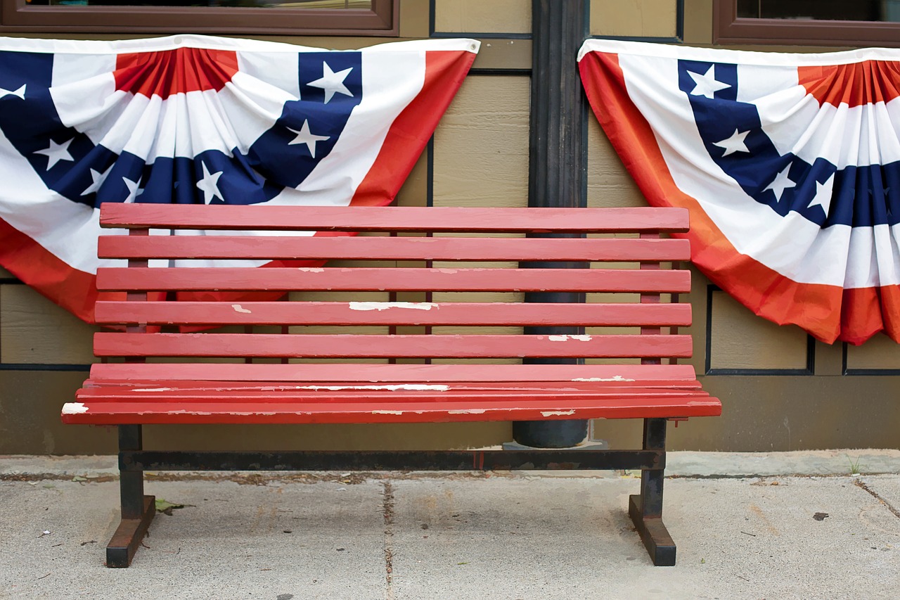 american flags bunting red bench free photo