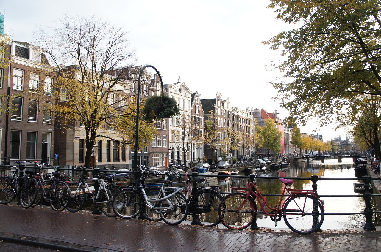 amsterdam bridge  bikes  amsterdam canal free photo