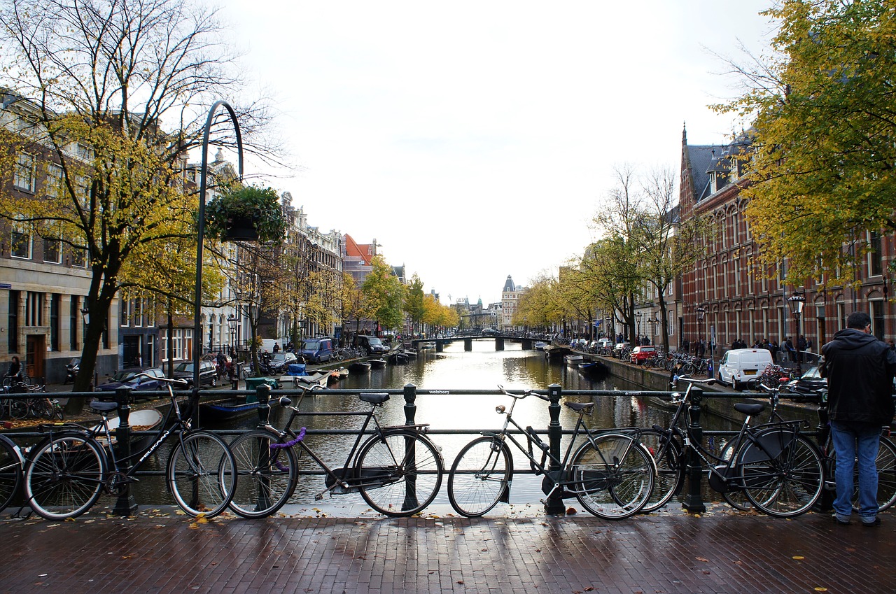 amsterdam bridge  bikes  amsterdam canal free photo