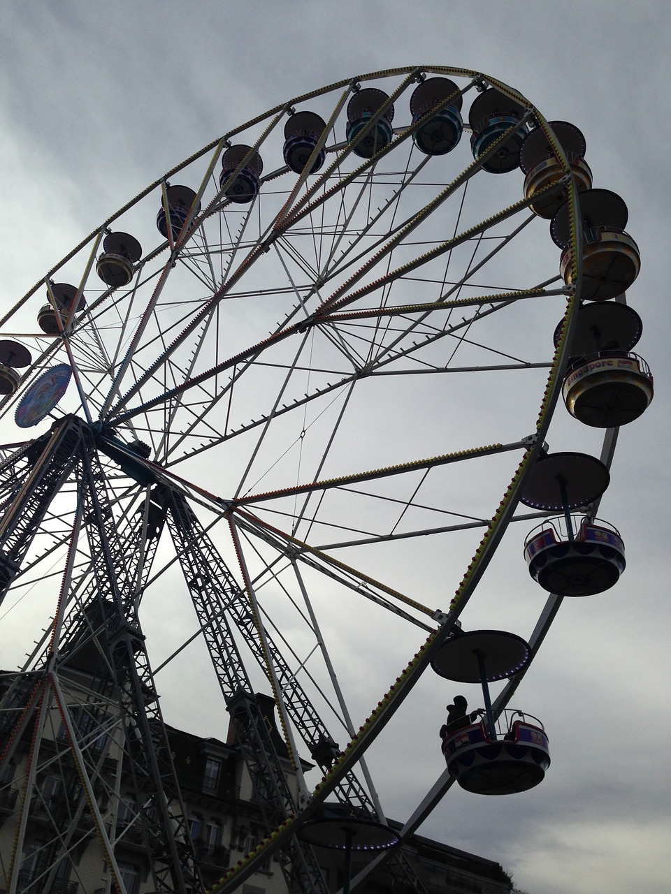 amusement park wheel dramatic overcast free photo