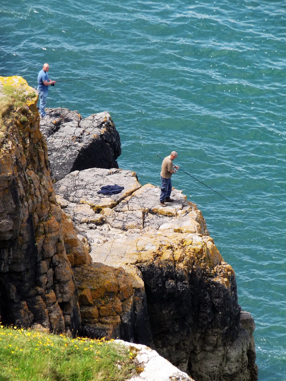 angler sea cliffs free photo