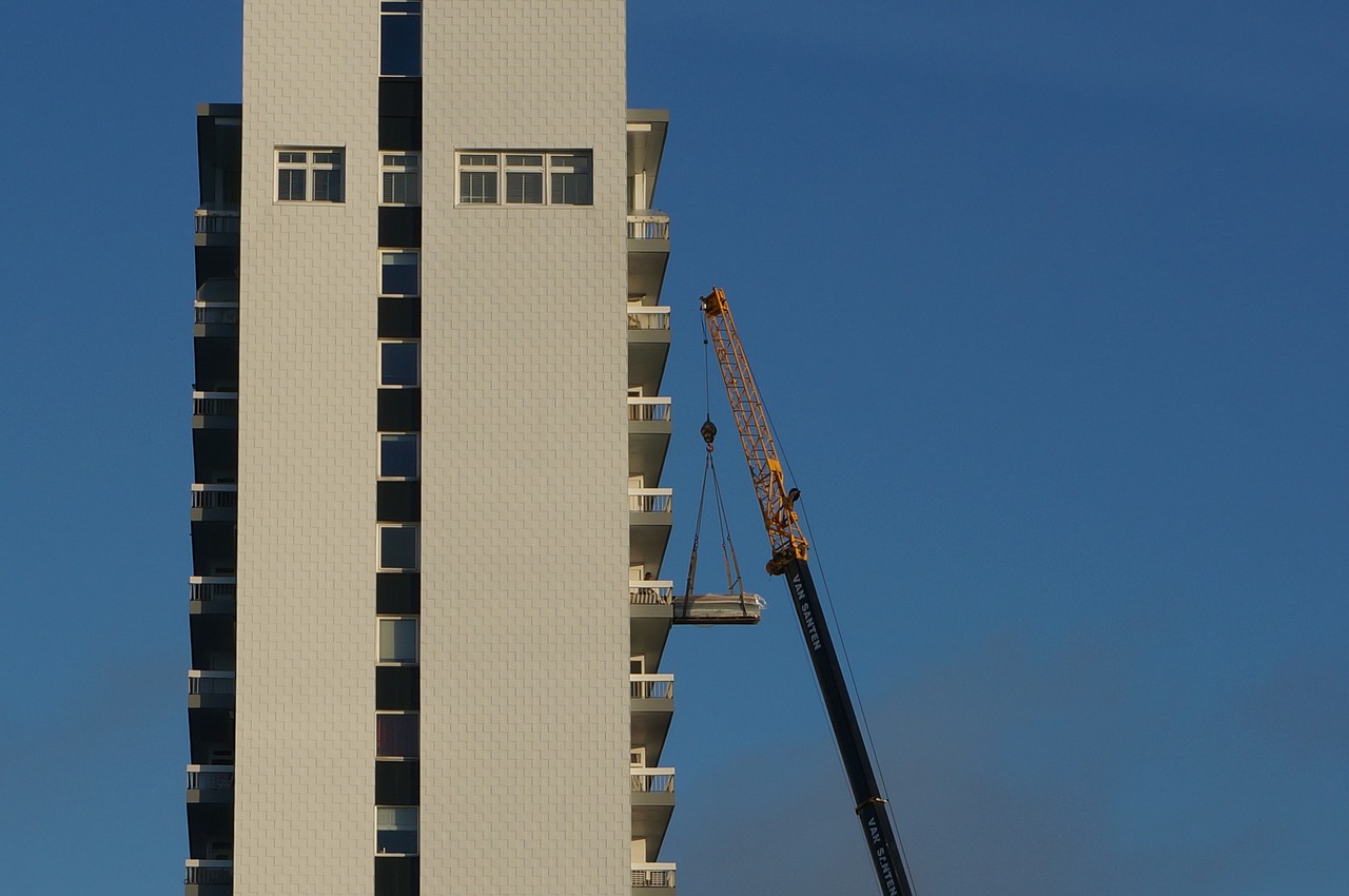 apartment building crane hoist free photo