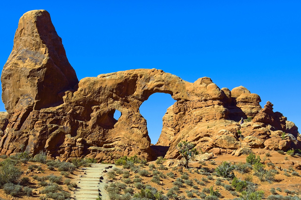 arch in a sandstone fin  sandstone  arches free photo