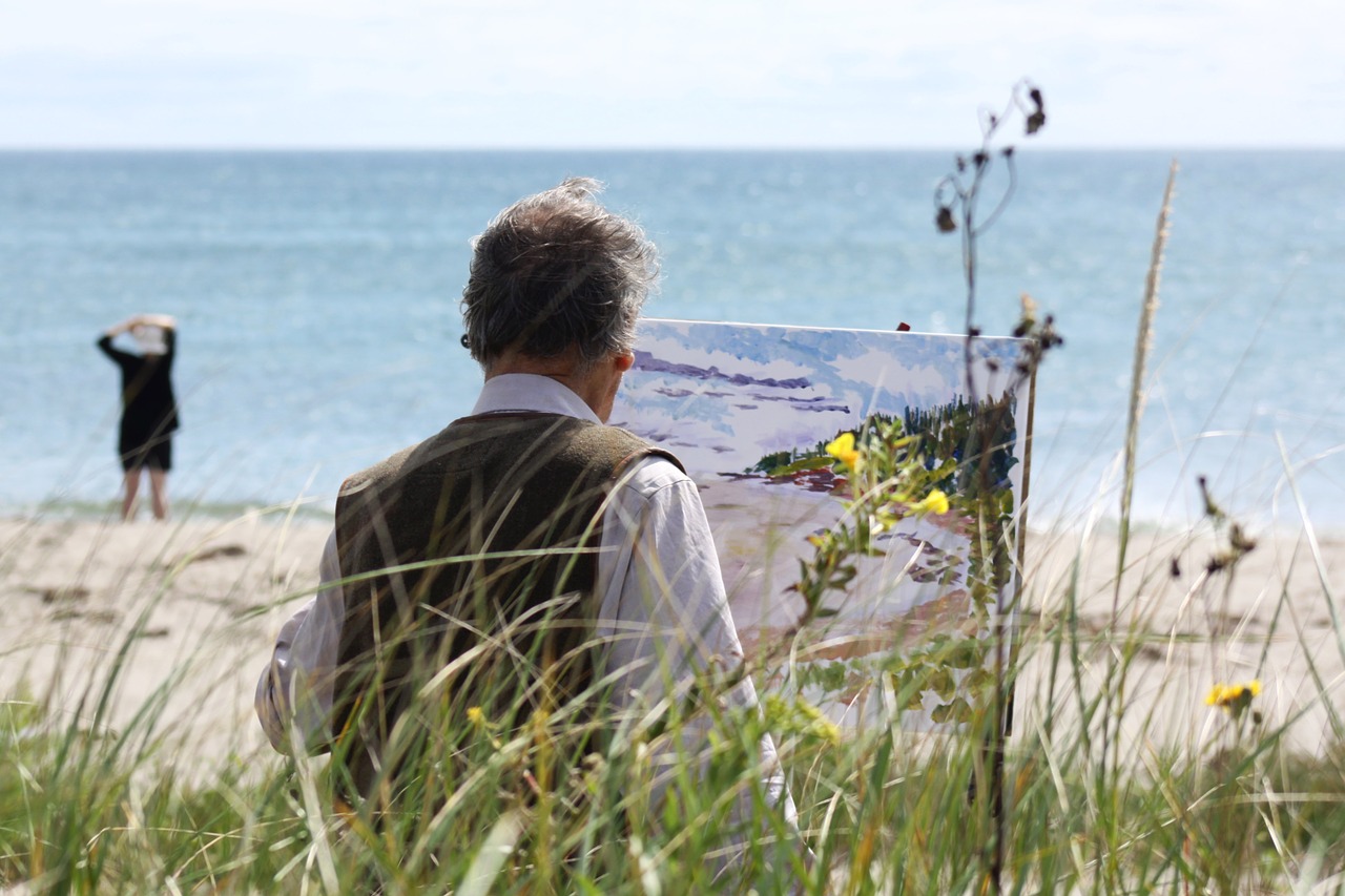 artist painting seascape free photo