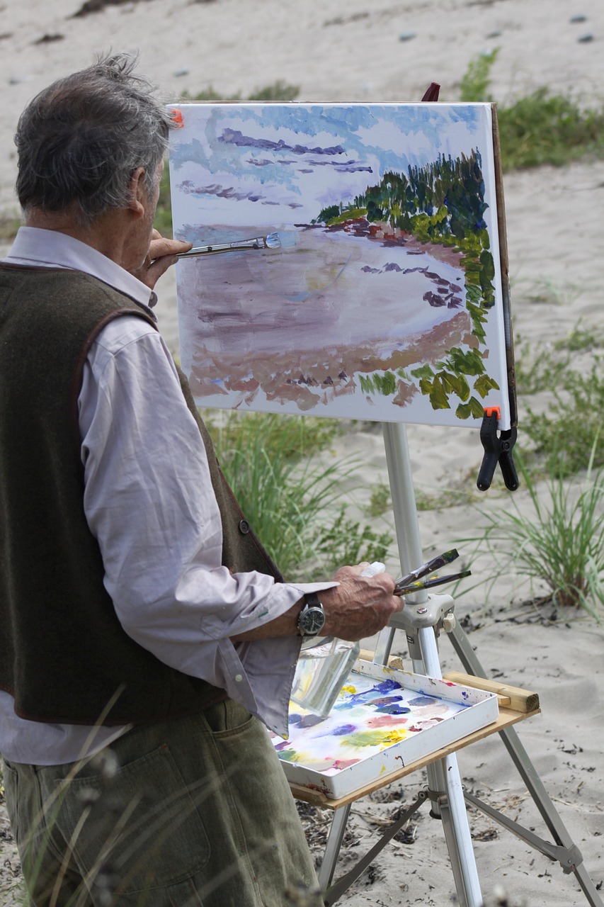 artist painting outdoors free photo