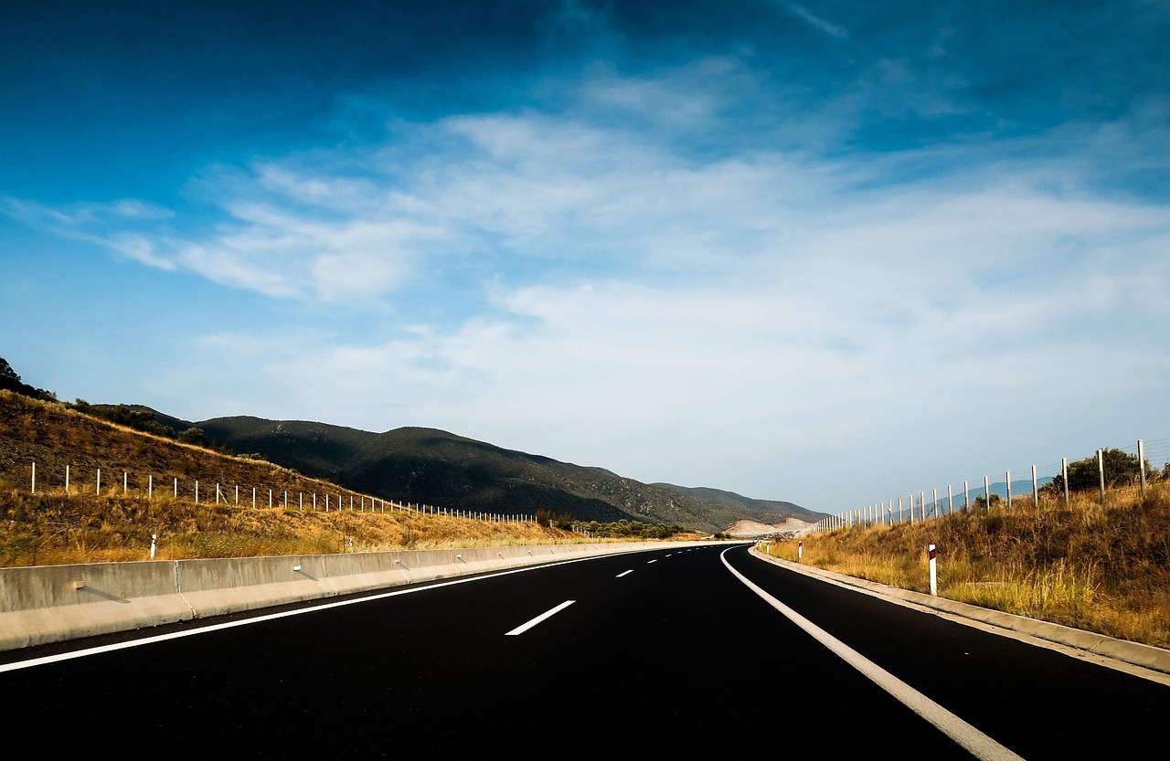 asphalt blue sky clouds free photo