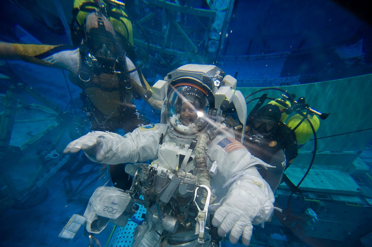 astronaut spacesuit under water free photo