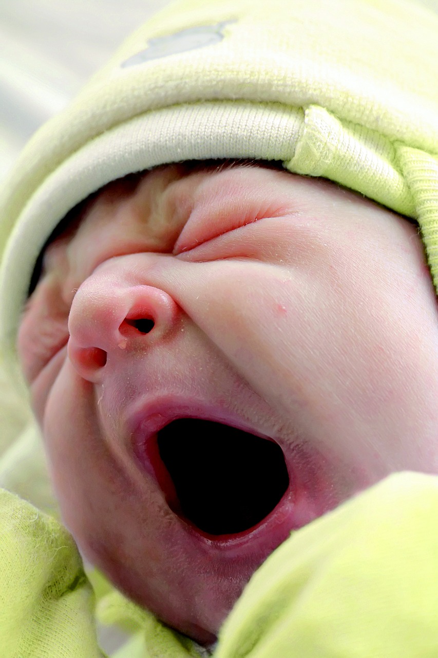 baby yawning face free photo