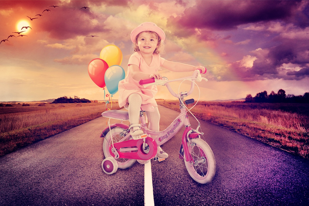 baby girl cycling road free photo