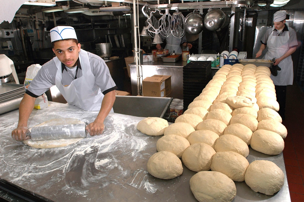 bakers baking bread free photo