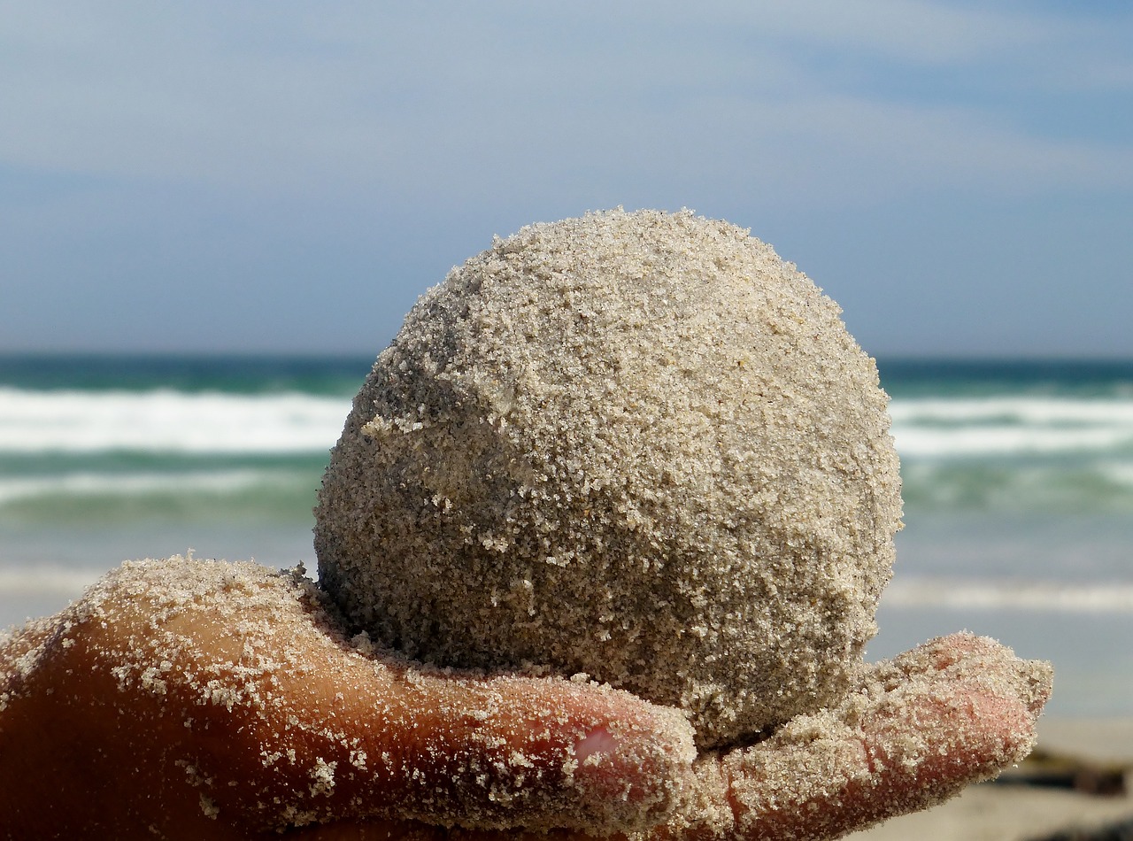 ball sand hand free photo