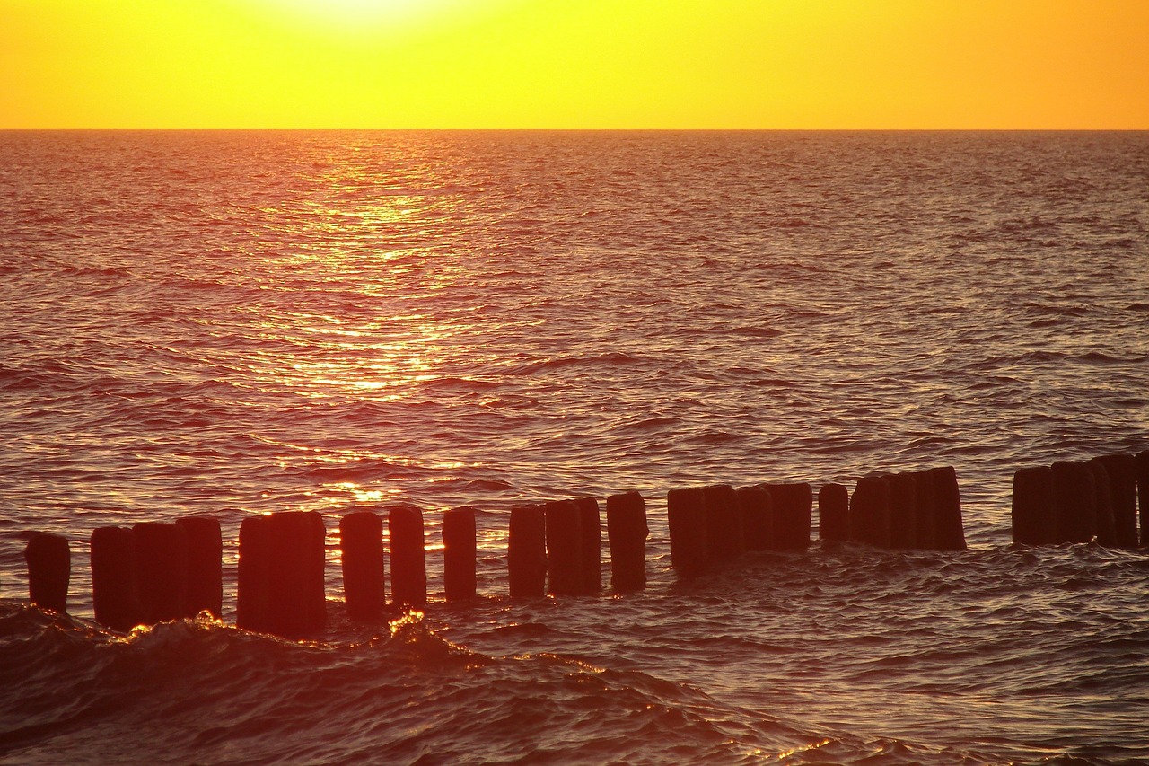 baltic sea breakwater sunset free photo