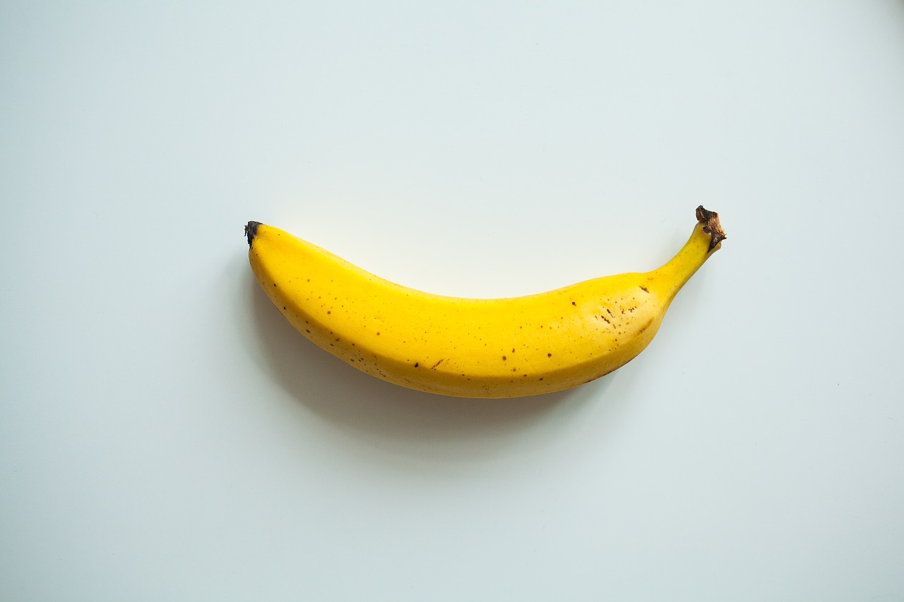 banana yellow white background free photo