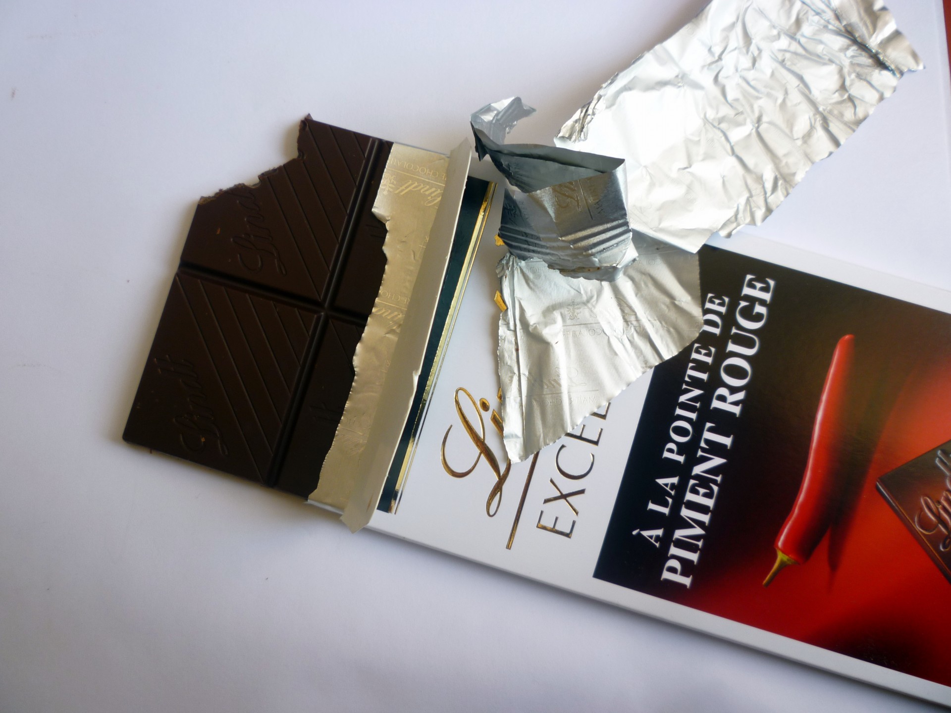 black chocolate candy packet free photo