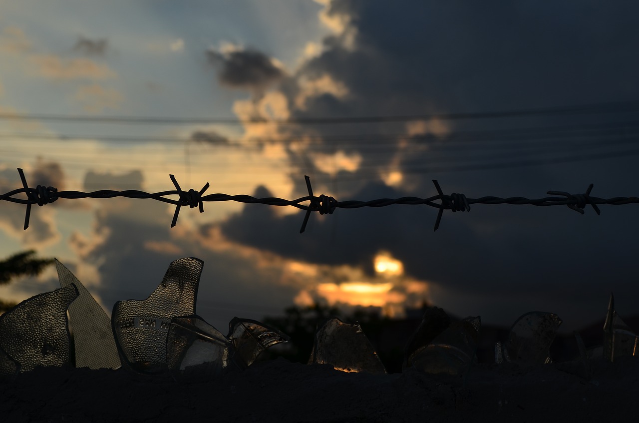 barb wire wire gloomy sky free photo