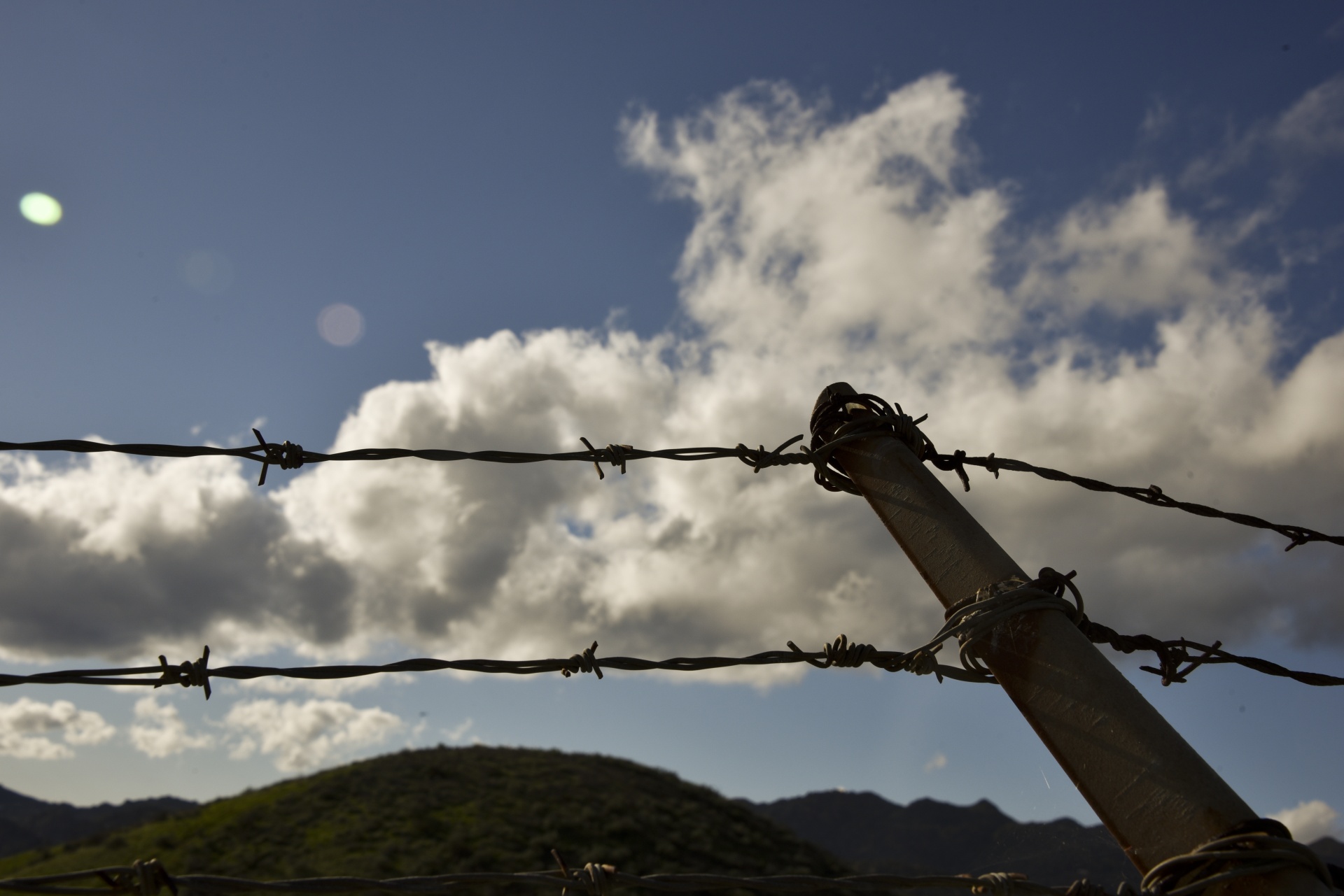 fence barb wire clouds free photo
