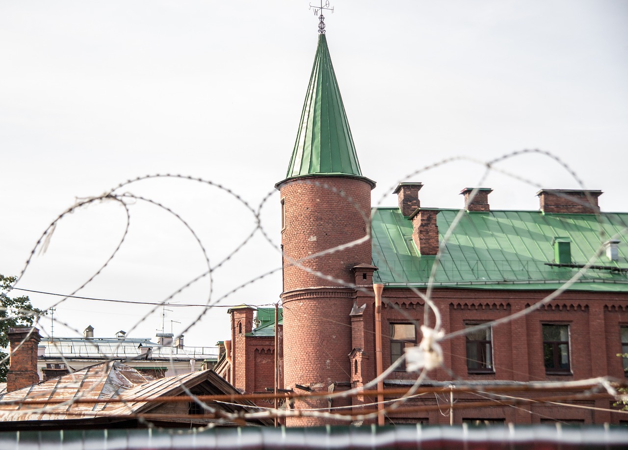 barbed wire tower brick free photo