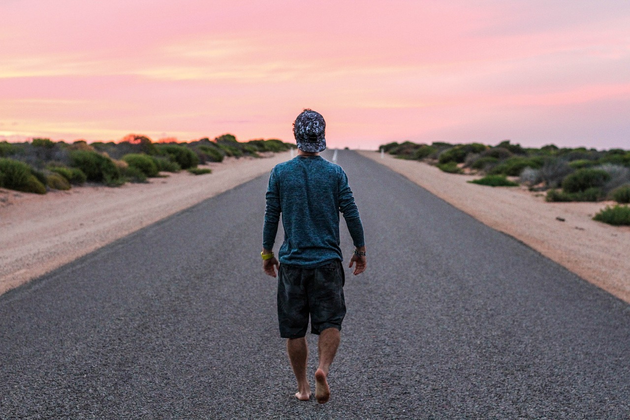 barefoot person road free photo