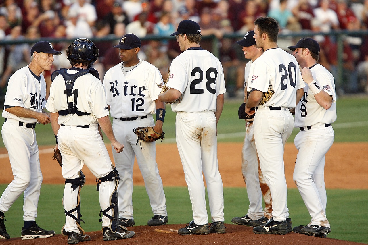 baseball team meeting on mound free photo