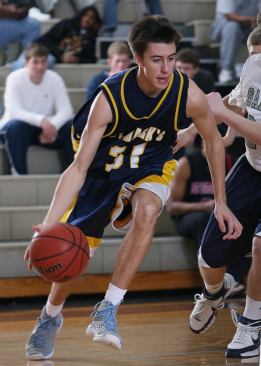 basketball player dribbling free photo