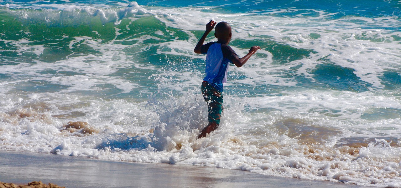 child sea wave free photo