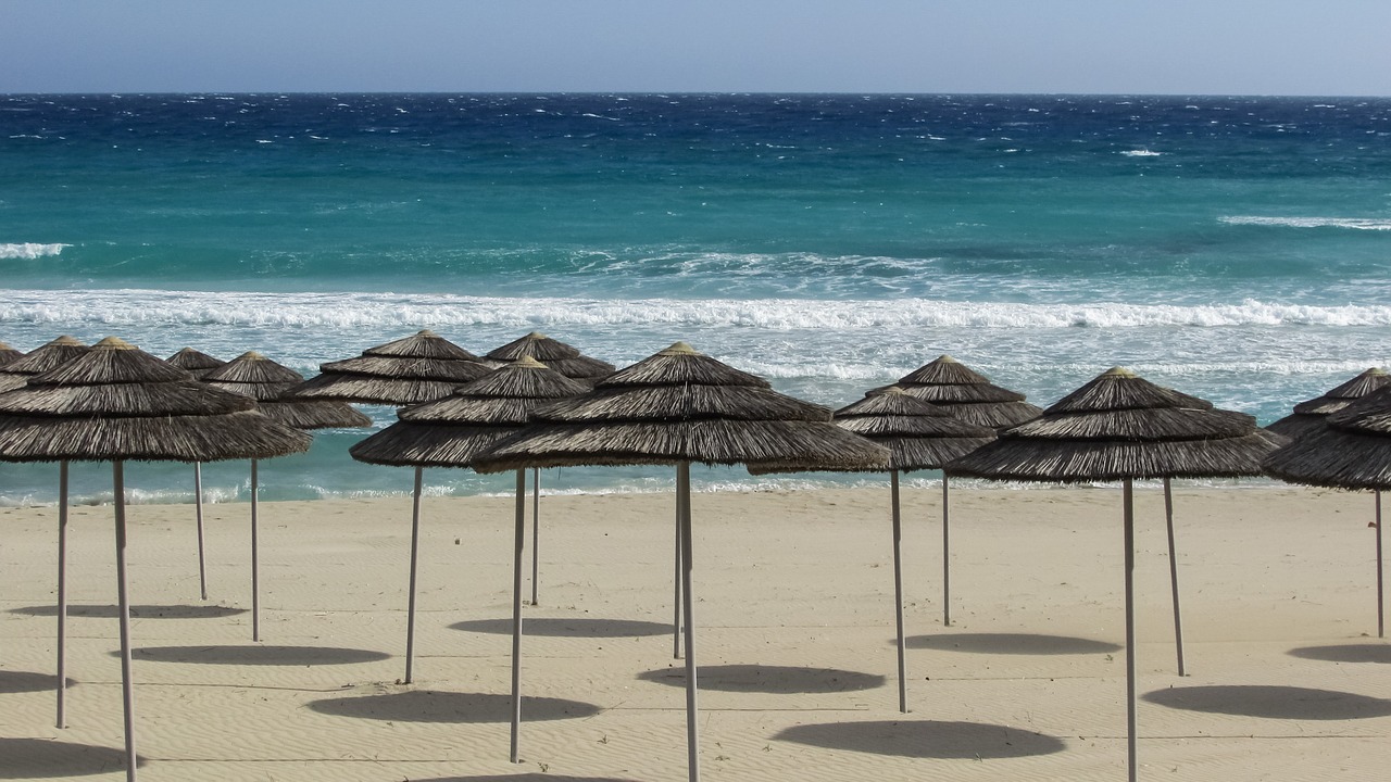 beach umbrellas sand free photo