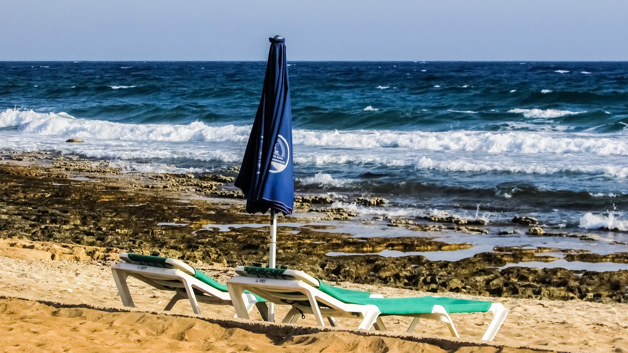 beach rocky coast sun bed free photo