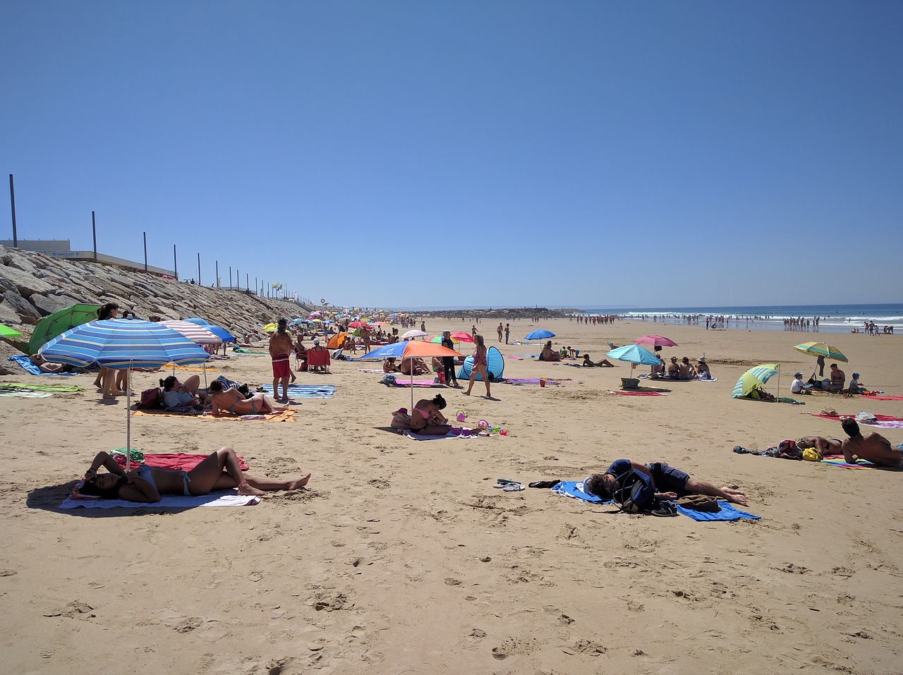 beach caparica coast sea free photo