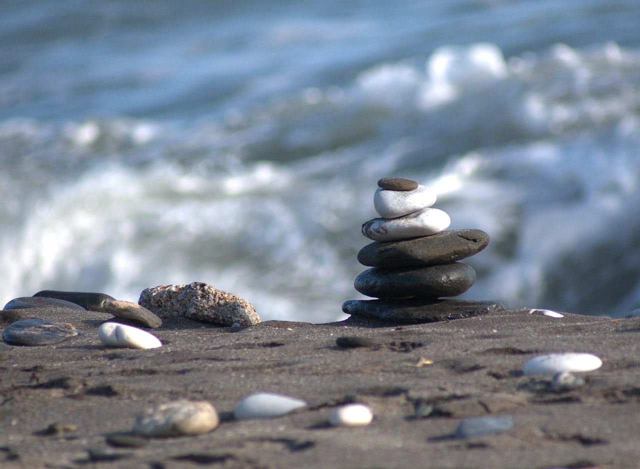 beach stone pile seascape free photo