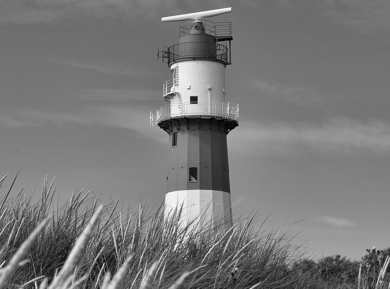 beach  sea  lighthouse free photo