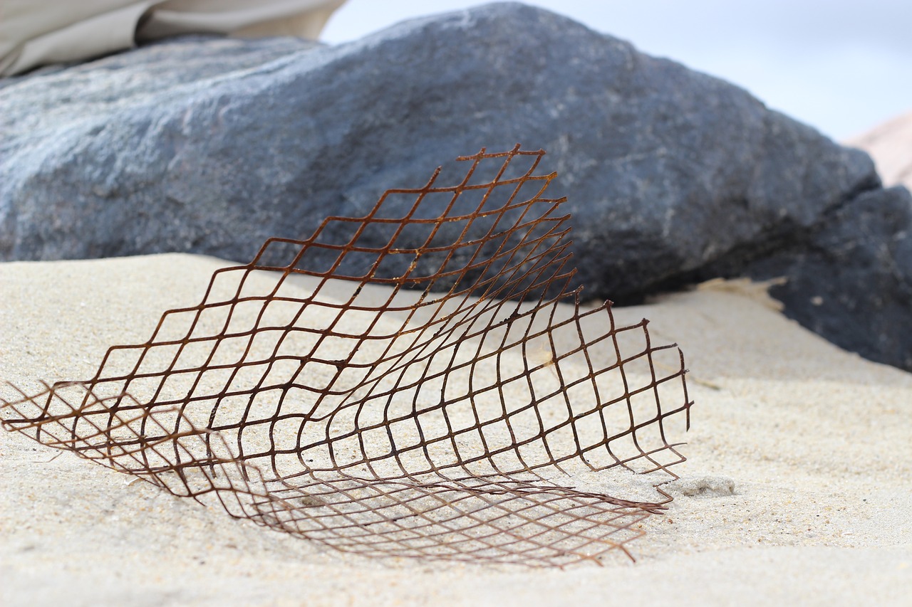 beach  steel mesh  sand free photo