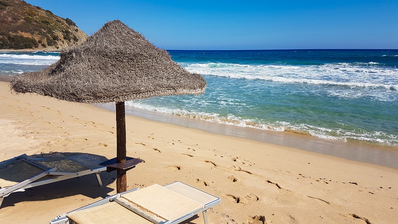 beach  sand  deck chair free photo