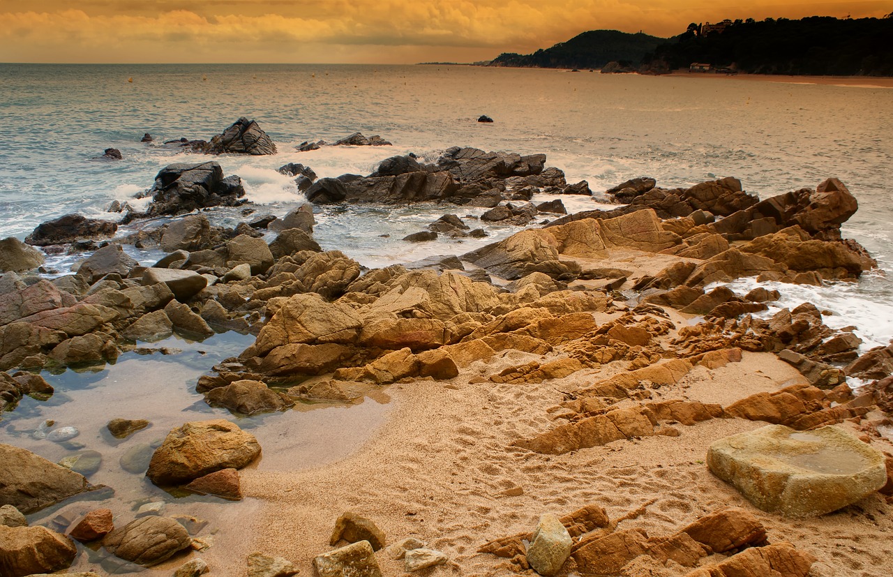 beach  rocks  sea free photo