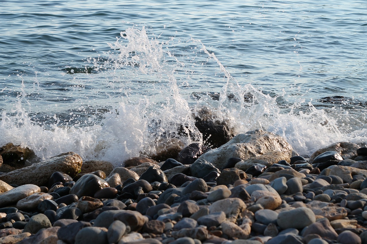 beach wave pebbles free photo